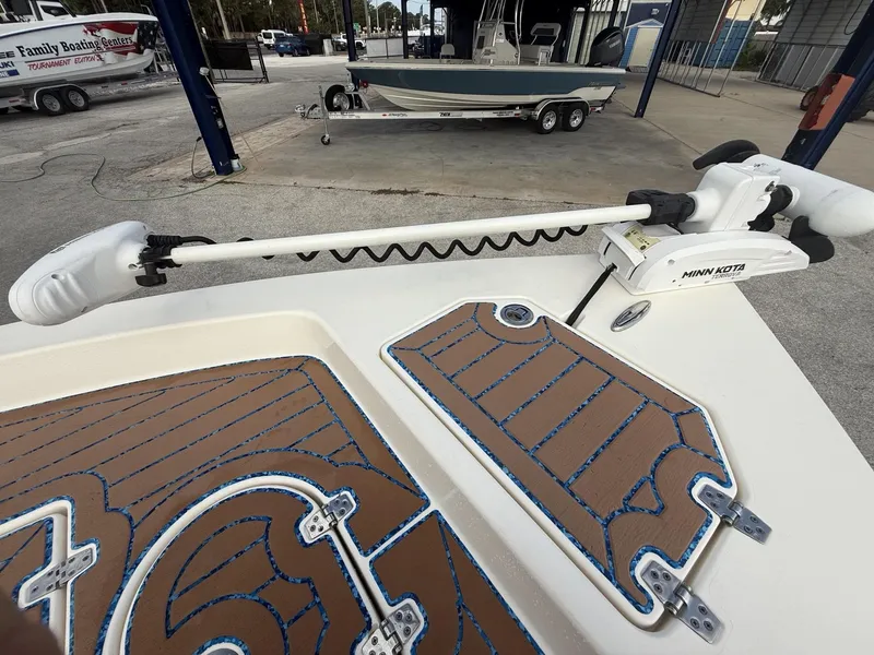 Slide: The Image of 2021 Pathfinder 2400 TRS boat with Minn Kota trolling motor at a marina. - 22