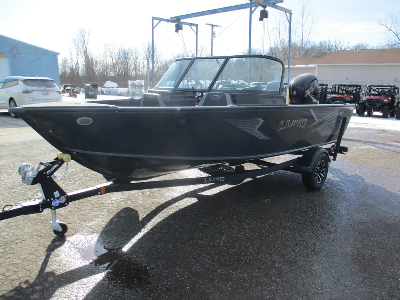 Slide: The Image of 2025 Lund Adventure 1775 Sport boat on trailer in outdoor setting. - 10
