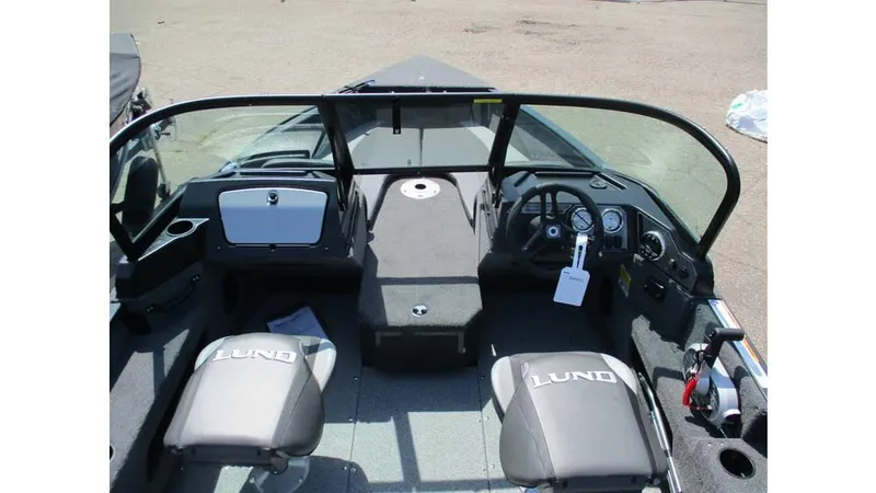 Slide: The Image of 2025 Lund Adventure 1775 Sport boat interior with dual seats and dashboard view. - 11