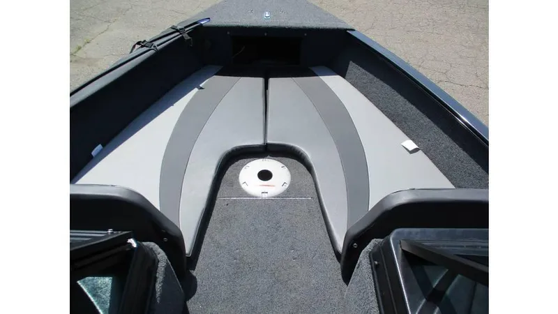 Slide: The Image of 2025 Lund Adventure 1775 Sport boat interior with gray seating and carpeted flooring. - 3
