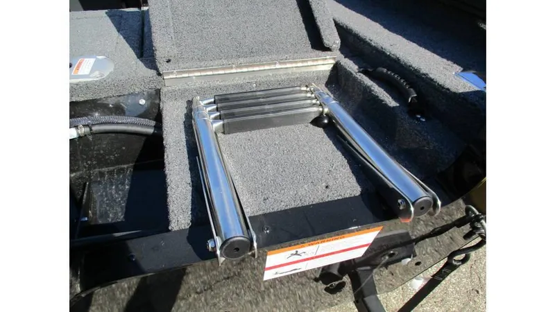 Slide: The Image of 2025 Lund Adventure 1775 Sport boat ladder on textured deck surface. - 6