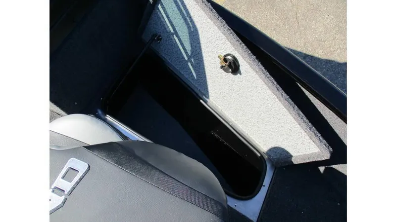 Slide: The Image of 2025 Lund Adventure 1775 Sport boat storage compartment with open lid. - 7