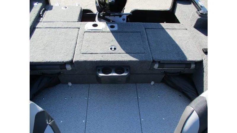 Slide: The Image of 2025 Lund Adventure 1775 Sport boat interior with carpeted deck and storage compartments. - 8