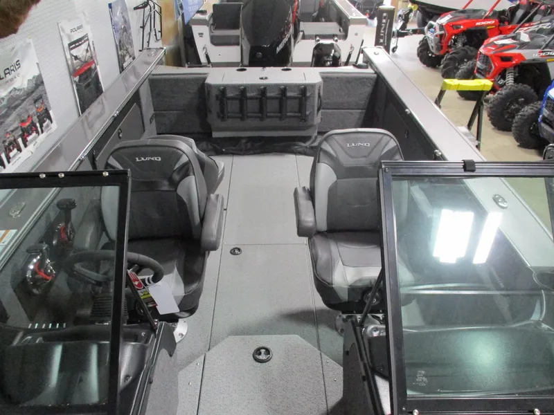 Slide: The Image of 2025 Lund 2075 Fisherman boat interior with seating and control panel. - 11