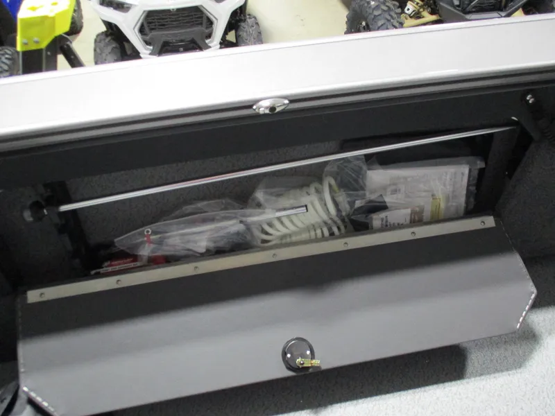 Slide: The Image of Storage compartment of 2025 Lund 2075 Fisherman boat with accessories and equipment. - 7
