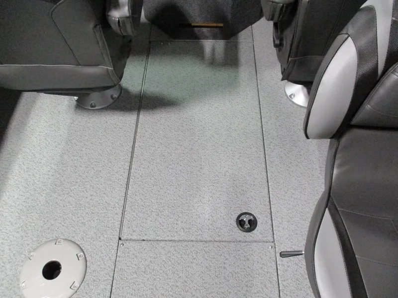 Slide: The Image of Interior view of 2025 Lund 2075 Fisherman boat, featuring gray flooring and seating. - 8