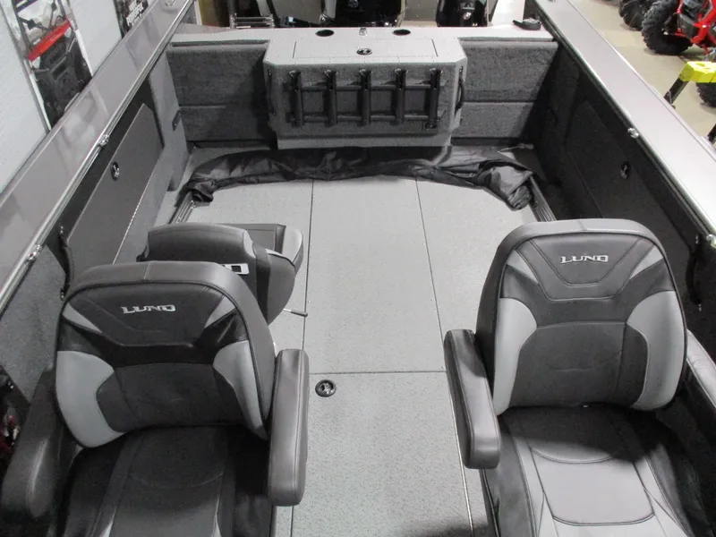 Slide: The Image of 2025 Lund 2075 Fisherman boat interior with two seats and storage compartments. - 9