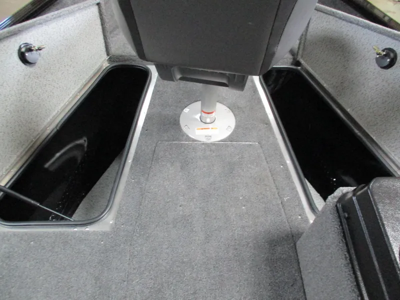 Slide: The Image of 2025 Lund 1775 Adventure SS boat interior with storage compartments and seating. - 9