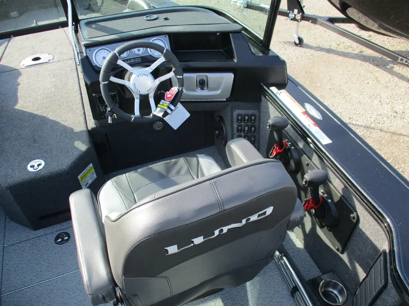 Slide: The Image of 2025 Lund 1975 Pro V Sport boat on trailer, parked outdoors. - 1