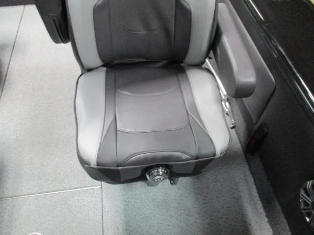 Slide: The Image of Captain's seat in 2025 Lund 1975 Pro V Sport boat, featuring sleek black and gray design. - 12