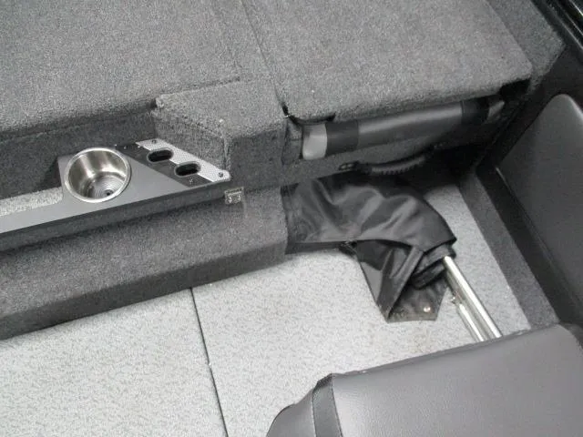 Slide: The Image of Interior of 2025 Lund 1975 Pro V Sport boat with cup holder and storage. - 13