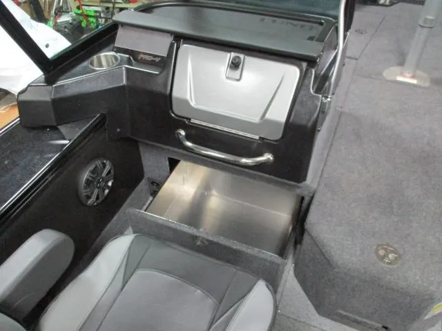 Slide: The Image of Dashboard of 2025 Lund 1975 Pro V Sport boat with gauges and steering wheel. - 19