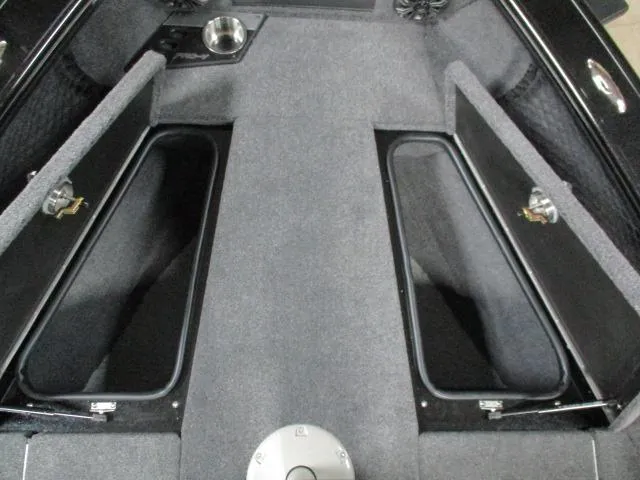 Slide: The Image of Interior of 2025 Lund 1975 Pro V Sport boat, featuring seating and storage compartments. - 21