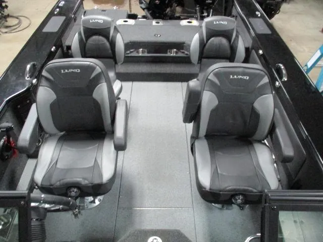 Slide: The Image of Interior of 2025 Lund 1975 Pro V Sport boat with four black and gray seats. - 24