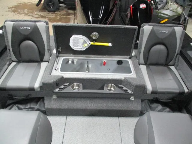 Slide: The Image of 2025 Lund 1975 Pro V Sport boat interior with seating and livewell. - 25