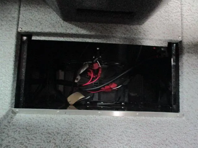 Slide: The Image of Interior view of a 2025 Lund 1975 Pro V Sport boat compartment with wiring. - 5