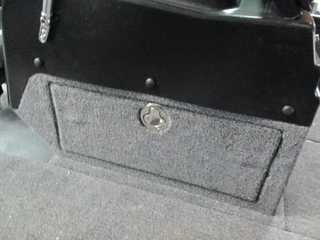 Slide: The Image of Interior storage compartment of 2025 Lund 1975 Pro V Sport boat. - 9