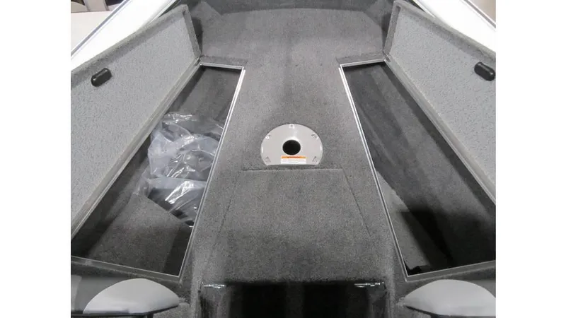 Slide: The Image of 2025 Lund Crossover XS 1875 boat interior with open storage compartments. - 13
