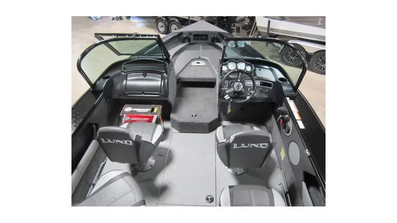 Slide: The Image of 2025 Lund Crossover XS 1875 boat interior with steering console and seating. - 4
