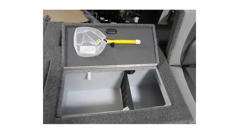 Slide: The Image of 2025 Lund Crossover XS 1875 boat storage compartment with net and yellow handle. - 8
