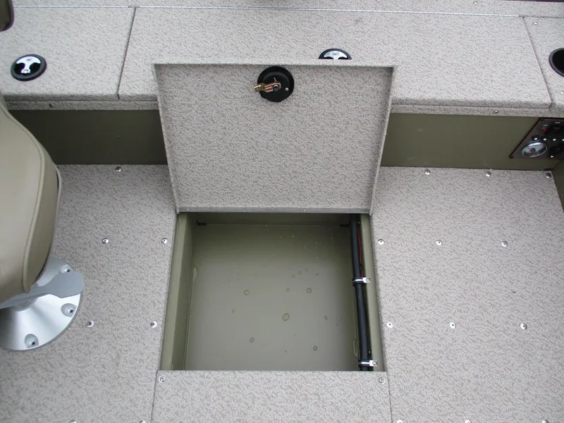 Slide: The Image of 2025 Lund Alaskan 1875 Tiller boat storage compartment with open hatch. - 12