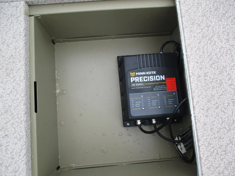 Slide: The Image of Minn Kota Precision charger in Lund Alaskan 1875 Tiller boat compartment, 2025 model. - 15