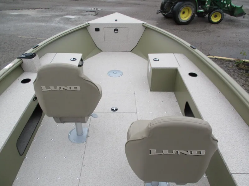 Slide: The Image of 2025 Lund Alaskan 1875 Tiller boat interior with two seats and spacious deck. - 3