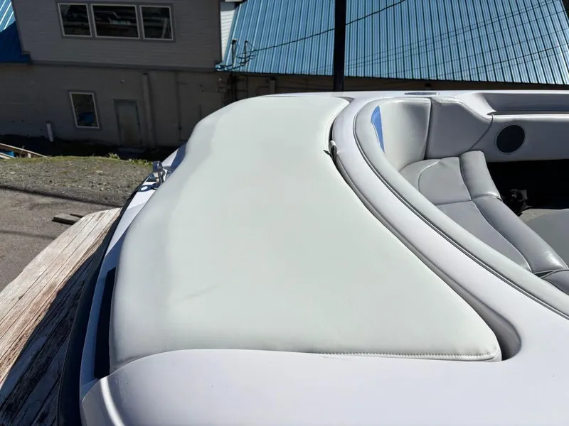 Slide: The Image of 2000 Nautique Air Nautique boat interior with white upholstery and gray accents. - 10