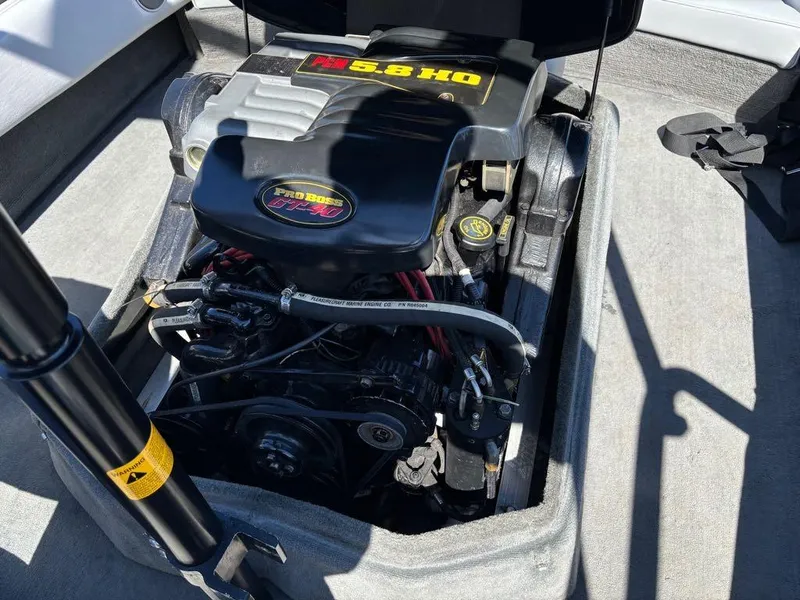 Slide: The Image of Engine compartment of a 2000 Nautique Air Nautique boat, featuring a 5.8 HO engine. - 11