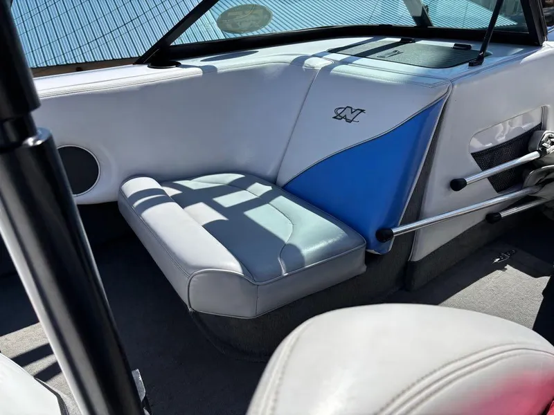 Slide: The Image of 2000 Nautique Air Nautique boat interior with blue and white seating. - 14