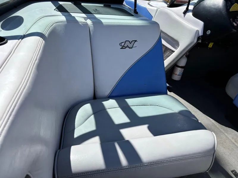 Slide: The Image of 2000 Nautique Air Nautique boat interior with blue and white seating. - 3