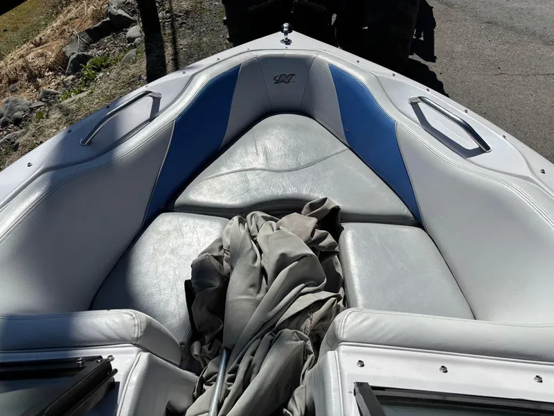 Slide: The Image of 2000 Nautique Air Nautique boat interior with gray and blue seating. - 4