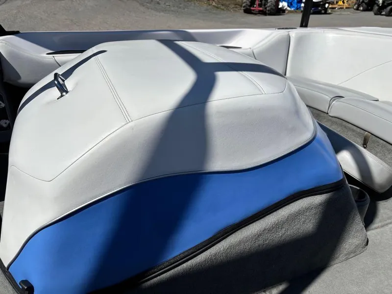 Slide: The Image of 2000 Nautique Air Nautique boat interior with white and blue upholstery. - 6