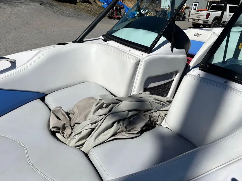 Slide: The Image of 2000 Nautique Air Nautique boat interior with white seating and windshield. - 9