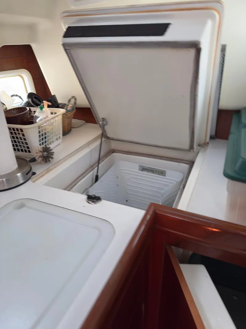 Slide: The Image of Open refrigerator in 2000 Beneteau 411 yacht kitchen interior. - 30