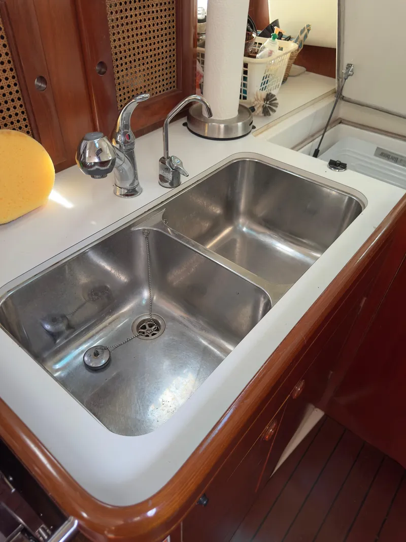 Slide: The Image of Stainless steel double sink in a 2000 Beneteau 411 yacht kitchen. - 31