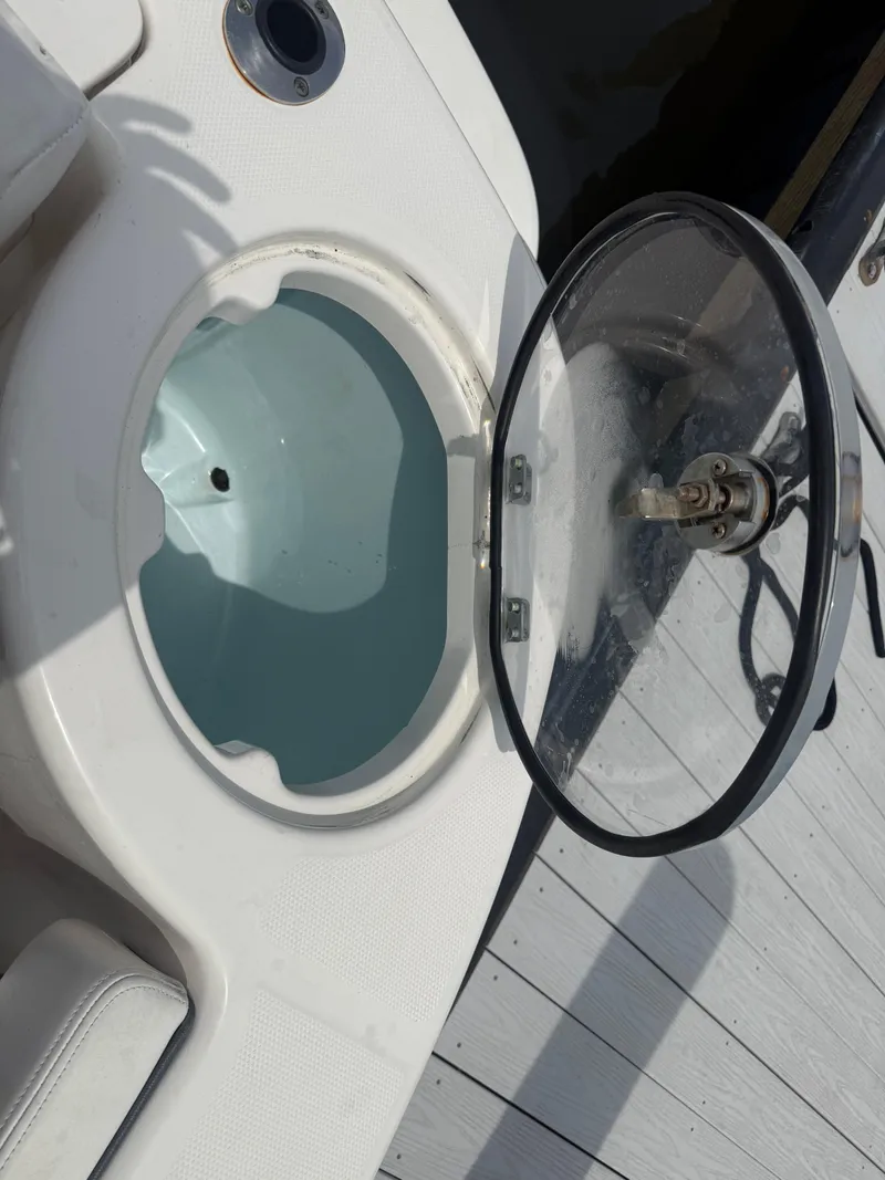Slide: The Image of 2019 Robalo R302 Center Console livewell with open lid on deck. - 15