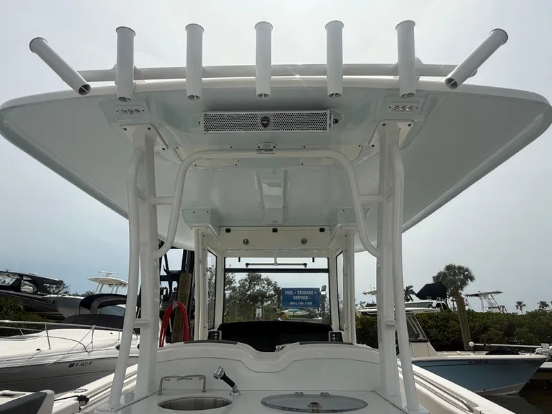 Slide: The Image of 2019 Robalo R302 Center Console boat with T-top and rod holders. - 22