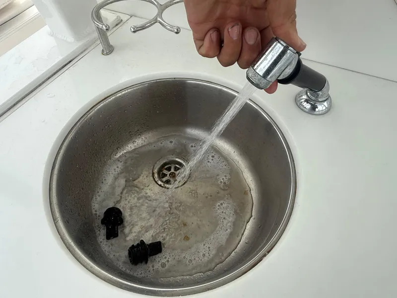 Slide: The Image of Sink with running water on 2019 Robalo R302 Center Console boat. - 26