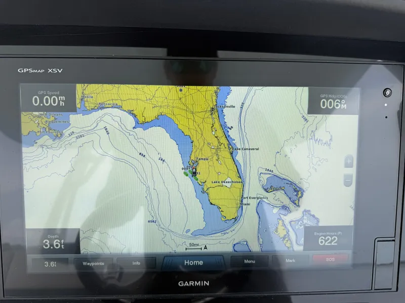 Slide: The Image of Garmin GPS display on 2019 Robalo R302 Center Console, showing nautical map and navigation data. - 43