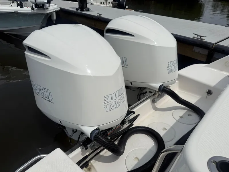 Slide: The Image of Twin Yamaha 300 engines on a 2019 Robalo R302 Center Console boat. - 9