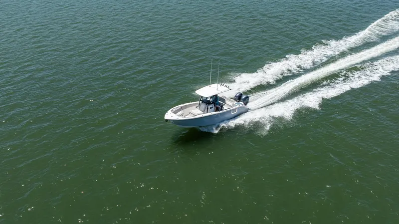 Slide: The Image of 2022 Sea Fox 268 Commander boat cruising on open water, aerial view. - 14