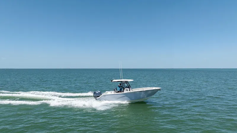 Slide: The Image of 2022 Sea Fox 268 Commander cruising on open water under clear blue sky. - 15