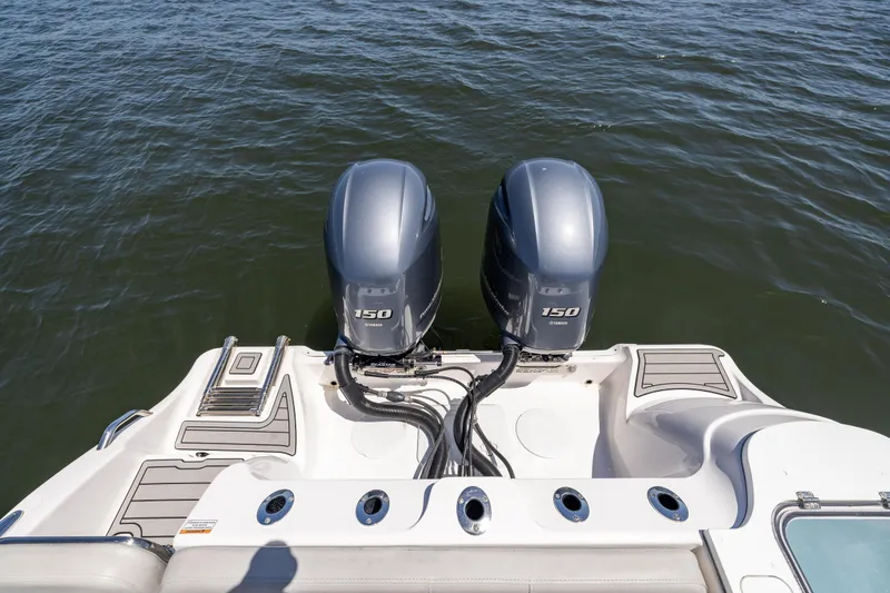 Slide: The Image of 2022 Sea Fox 268 Commander boat with dual 150 horsepower engines on water. - 17