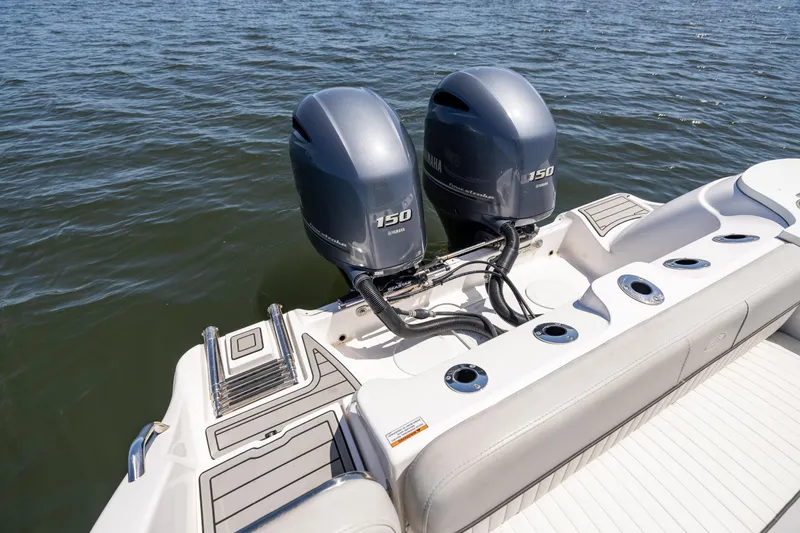 Slide: The Image of 2022 Sea Fox 268 Commander with dual 150 horsepower engines on open water. - 18