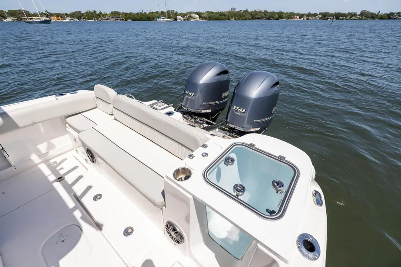 Slide: The Image of 2022 Sea Fox 268 Commander boat with twin outboard engines on a calm lake. - 22