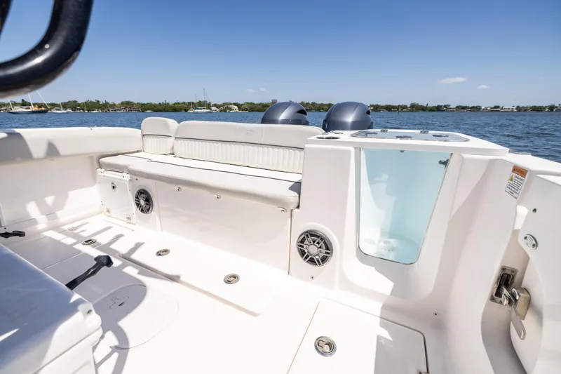 Slide: The Image of 2022 Sea Fox 268 Commander boat interior with seating and ocean view. - 23