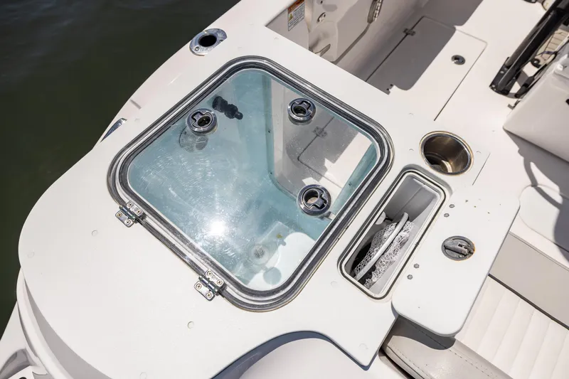 Slide: The Image of 2022 Sea Fox 268 Commander boat deck with storage compartments and glass hatch. - 25