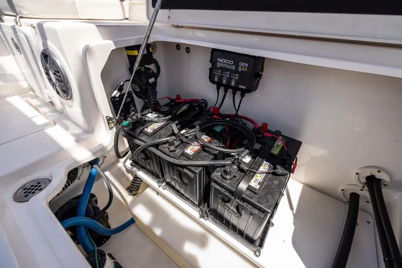 Slide: The Image of 2022 Sea Fox 268 Commander boat battery compartment with wiring and charger. - 27