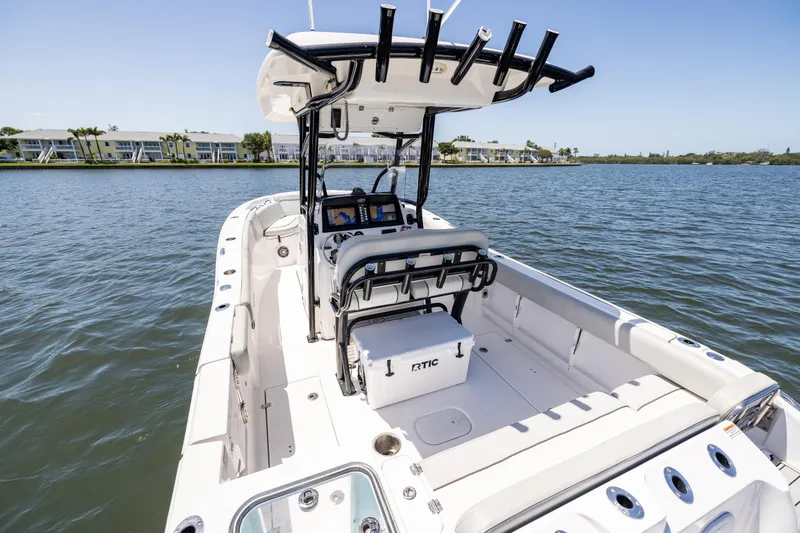 Slide: The Image of 2022 Sea Fox 268 Commander boat on calm water, featuring spacious deck and modern design. - 29